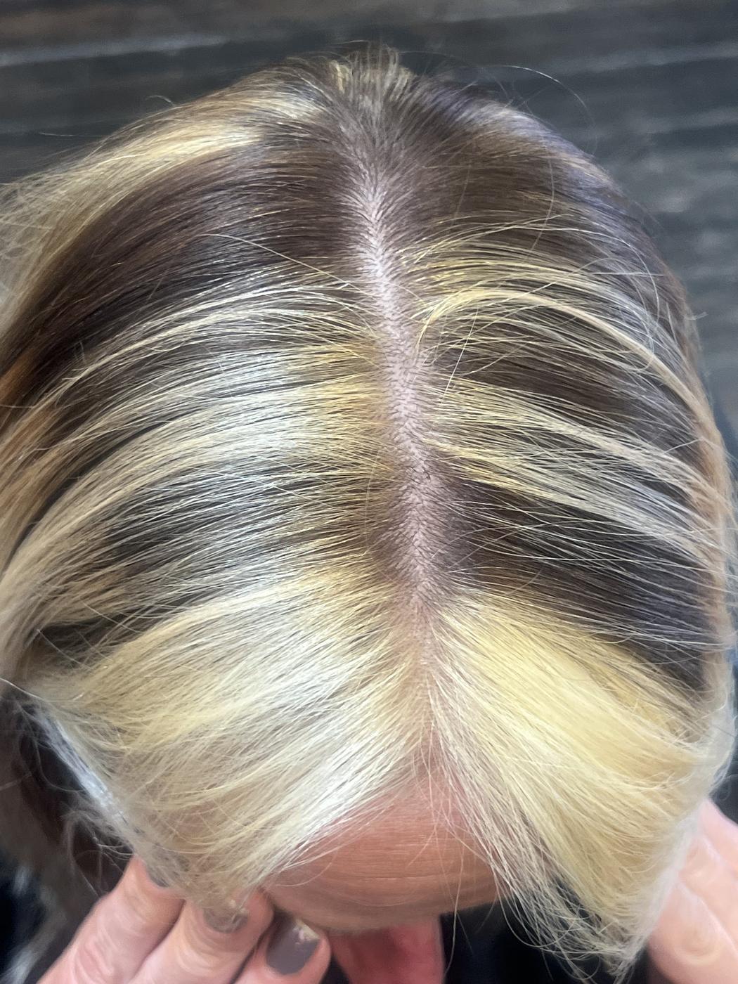 Close-up overhead view of a crown highlight parting